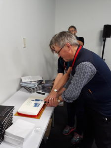 The owners of Cicerone Press cutting the cake